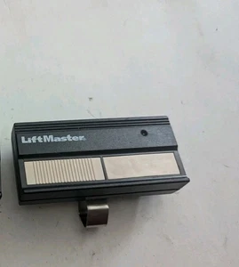 LiftMaster 82LM 2 Button Remote Control Transmitter Dip Switch W/Visor Clip - Picture 1 of 2