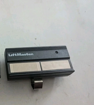 LiftMaster 82LM 2 Button Remote Control Transmitter Dip Switch W/Visor Clip - Image 1 of 2
