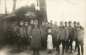 WWI RPPC Postcard German Soldiers With Tiny Child Person in Apron - Picture 1 of 2