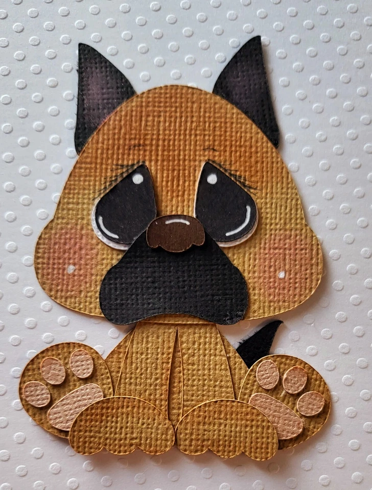 Pequeño cachorro marrón. Álbum de recortes, piezas de papel para hacer tarjetas Foto 1 de 1