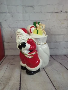 Tarro de galletas de Navidad de cerámica Mervyns vintage Santa sosteniendo saco de juguete caja original - Imagen 1 de 11
