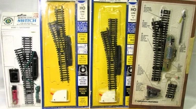 Lot of 4 HO Left Switches All Remote Control AHM, Tyco, Bachmann in Open Packs - Image 1 of 4