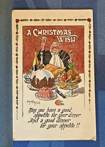 J T & Co Donald McGill Comic Postcard 1910s Good Dinner A CHRISTMAS WISH - Picture 1 of 2