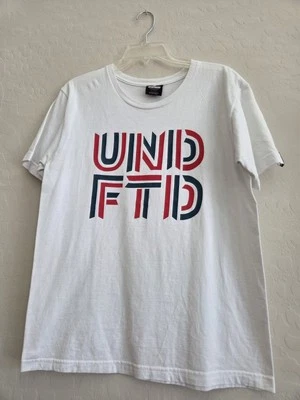 Undefeated UNDFTD T Shirt Size M White with Red/Dark Green Logo Short Sleeve - Image 1 of 4