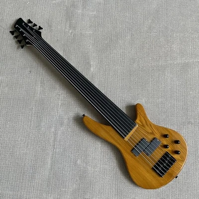 Bajo eléctrico amarillo sin trastes cuerpo sólido 7 cuerdas hardware negro en EE. UU. Foto 1 de 4