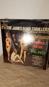 007 The James Bond Thrillers The Roland Shaw Orchestra Lp Vinyl Record VG - Foto 1 di 3