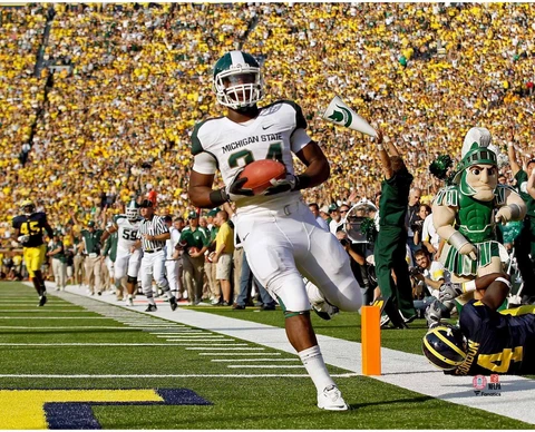 Le'Veon Bell Michigan State Spartans Unsigned Touchdown vs. Michigan Photograph Cover