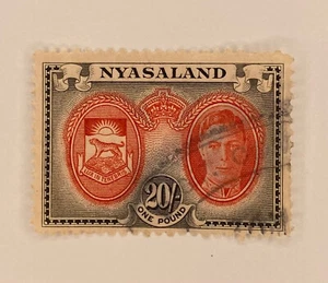 #81 Single stamp black and red Nysaland 1945 used 20 shilling F087 - Picture 1 of 2