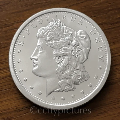 Ronda de plata fina Morgan .999 GSM de 1 oz • BU • Diseño Golden State Mint #1 Foto 1 de 2