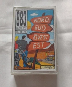 Musicassetta MC 883 Nord Sud Ovest Est FRI60194 Ottime Condizioni Rossa - Picture 1 of 9