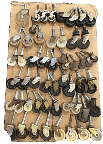 54 Assorted Vintage casters different sizes and materials from plastic to wood Cover