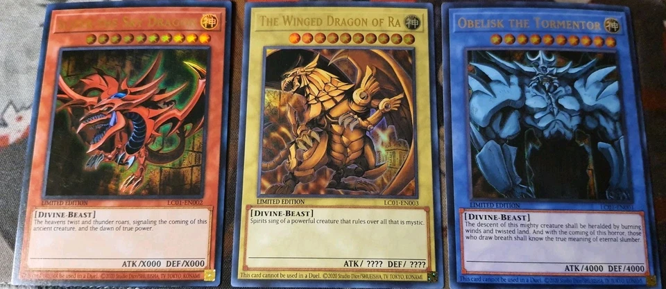 YuGiOh DIOS CARTAS OBELISCO EL TORTURADOR SLIFER EL CIELO DRAGÓN ALADO RA LP Foto 1 de 1