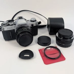 Canon AE-1 analoge Kleinbildkamera FD 50mm F1.8 Objektiv Brennweite 2x Konverter Oberlichtfilter - Bild 1 von 18