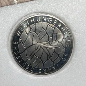 10 Euro Gedenkmünze 2012 , " 50 Jahre Deutsche Welthungerhilfe "  - Bild 1 von 1