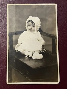 Baby in White Sitting on Chair Real Photo Postcard RPPC - Picture 1 of 4
