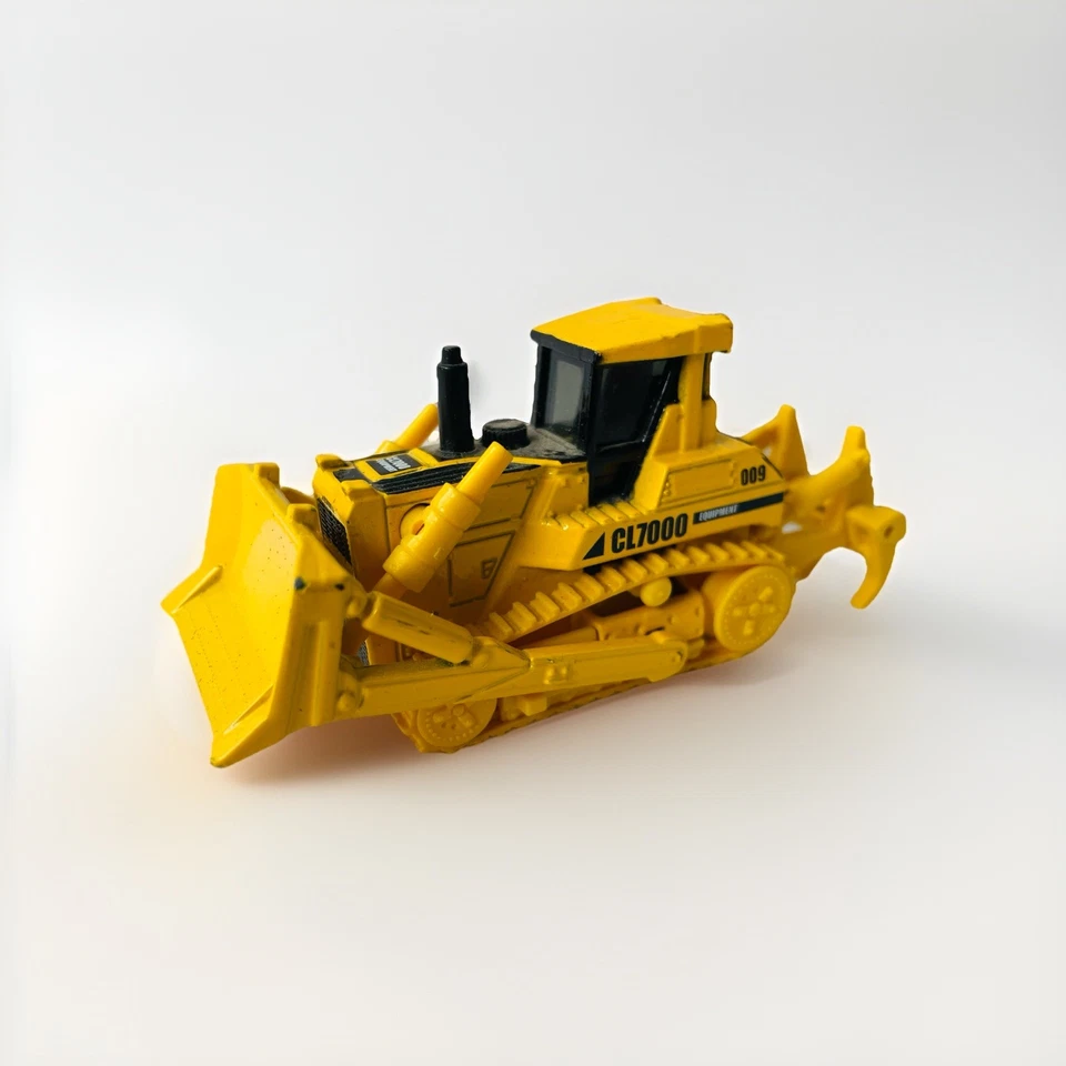 Bulldozer Matchbox Real Working Rigs CL7000 en amarillo (2008, RW009, 9 cm) - En muy buena condición Foto 1 de 4