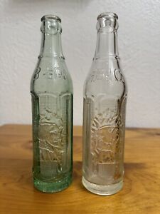 2 Vintage Big Chief Indian Embossed Soda Bottles~Green & Clear