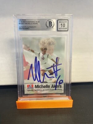 Equipo Nacional Femenino de Estados Unidos 1999 - firmado por Michelle Akers Beckett automático 10 Foto 1 de 2