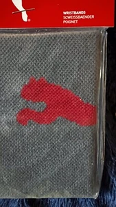 Schweißband grau mit rotem Logo von Puma neu ein Schweißband - Bild 1 von 3