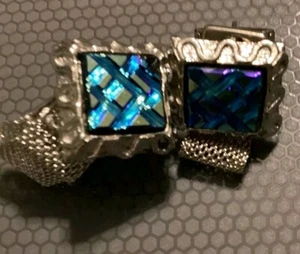 gemelos geométricos azul y plata con reflejo morado - Imagen 1 de 3