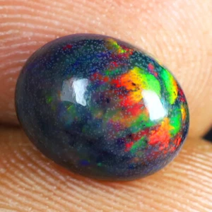 1.73 ct Elegant Oval Cabochon (10 x 8 mm) Ethiopian Flashing Black Opal - Picture 1 of 1
