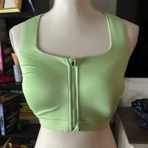 Reggiseno sportivo all in motion taglia 36DD verde con cerniera davanti - Foto 1 di 5