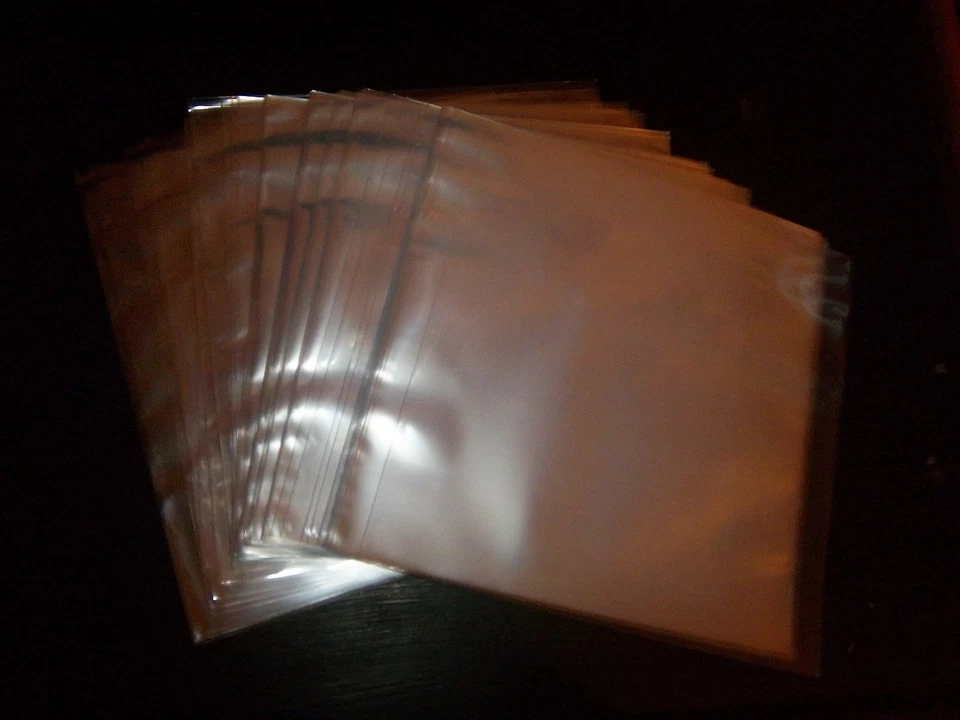 100ct 7" 45 RPM Clear Plastic Outer Jackets for Vinyl Records PLUS 45 rpm record - Image 1 of 1