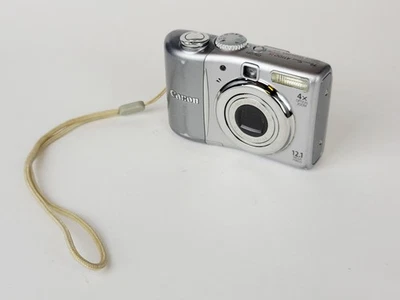 Canon PowerShot A1100 IS Digital Camera 12.1MP 4X Zoom Silver (PARTS OR REPAIR)  - Image 1 of 4