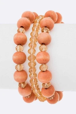 Juego de brazaletes elásticos con cuentas madera y dorado boho Foto 1 de 2