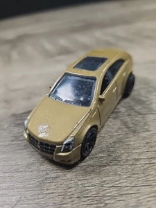 Cadillac CTS Wagon 2010 Matchbox dorado diecast 1/64 Mattel coche de juguete suelto - Imagen 1 de 6