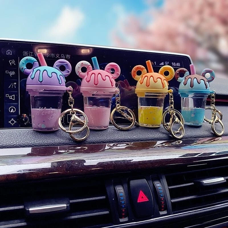 Lindo llavero de taza de té de leche de dibujos animados con líquido flotante - Perfecto para parejas Foto 1 de 4