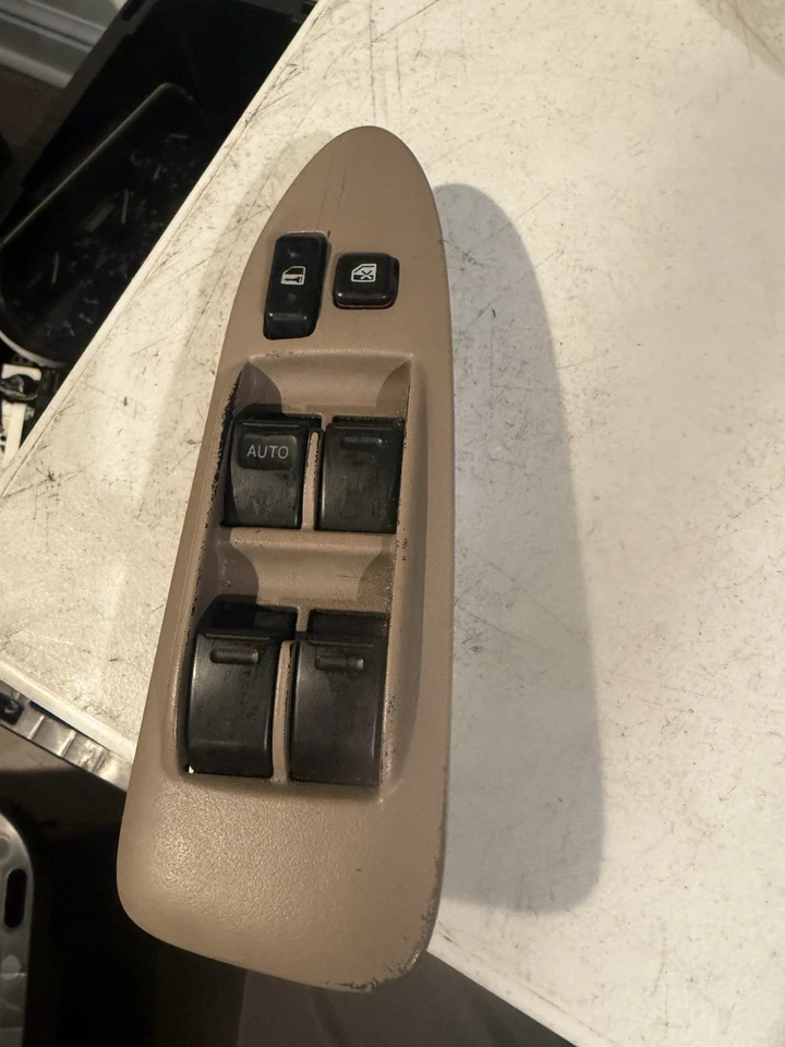 Toyota Camry LE 1997-2001 interruptor de bloqueo de ventana maestra del conductor izquierdo con bisel bronceado Foto 1 de 4
