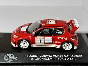 PEUGEOT 206 WRC #1 M.GRONHOLM-T.RAUTIAINEN RALLYE MONTECARLO 2003 IXO RAM 1:43 - Foto 1 di 11