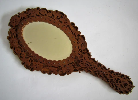 antique hand mirror in a carved wooden frame Cover