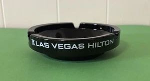 Las Vegas Hilton Black Glass Souvenir 4.25” Wide Ashtray - Picture 1 of 3