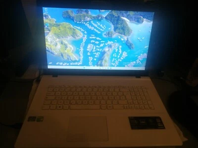 PC portable ASUS F75V - Photo 1/4