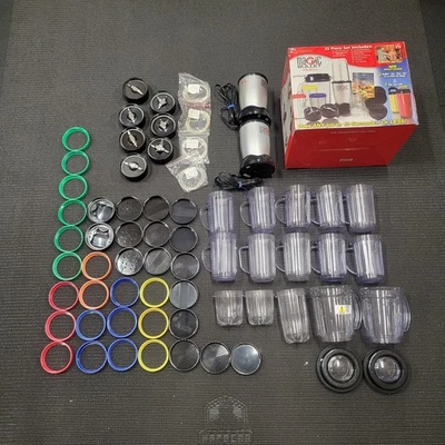 Huge Magic Bullet Lot – 2 Bases, Blades, Cups, Lids - Over 60 Pieces - Image 1 of 4
