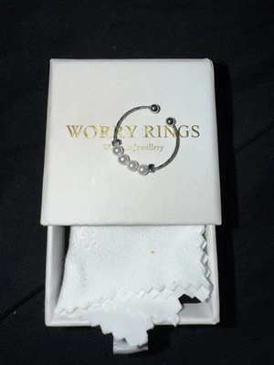 Anillo de preocupación giratorio de perlas de plata de ley 925 Foto 1 de 2