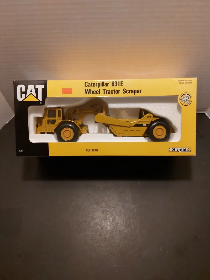 Rascador tractor de ruedas Caterpillar Cat 631E - ERTL escala 1:50 modelo fundido a presión #2430 Foto 1 de 4