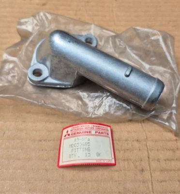 1980-1986 Dodge Colt Plymouth Champ 1.4L 1.5L NOS Mitsubishi THERMOSTAT HOUSING - Image 1 of 3