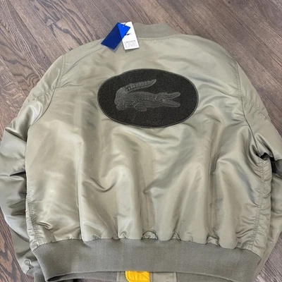 Lacoste -Ogo Flight Bomber Back Patch Logo   Size L - Image 1 of 4