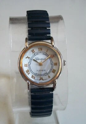 Reloj informal elegante de moda con banda elástica azul con números romanos para mujer Foto 1 de 4