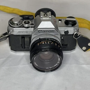 Canon AE-1 35mm SLR Film Camera w/ 50mm f/1.8 Lens Look 👀 - Picture 1 of 8