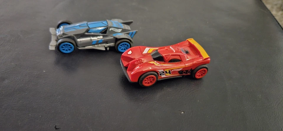 1/43 HOTWHEELS !!! TWO CARS  WILL RUN ON CARRERA TRACKS CHECK OUT THE PIX  - image 1 of 4