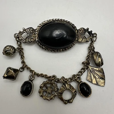COSTUME ANTIQUE BLACK STONES DANGLY CHAIN W/ CHARMS BROOCH PIN - Image 1 of 4