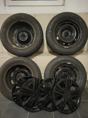 4x Winterreifen 185/65 R15 auf Stahlf. Peugeot 207 inkl. Radschrauben & Zierbl. - Bild 1 von 4