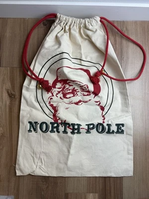 North Pole Santa Sack Christmas Gift Canvas Bag Bells 19in by 26 in - Image 1 of 4