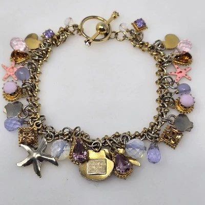 Brazalete vintage con dije Lunch At The Ritz Sealife tono dorado cristales de estrellas de mar etc. Foto 1 de 4