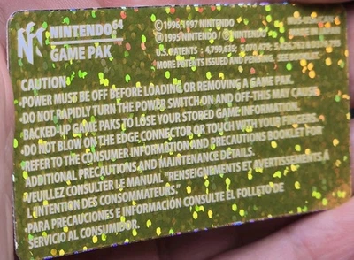 1 PACK DE JUEGOS NINTENDO 64 N64 CARTUCHO NUS-001 (EE. UU.) ETIQUETA PURPURINA DORADA PEGATINA Foto 1 de 4