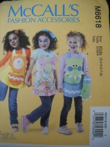 Grembiule bambini guanti farfalla dinosauro leone taglia 3-8 modello cucito McCall's 6618 - Foto 1 di 2